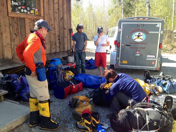 Finishing up their packing and weighing their gear for the flight to the glacier.