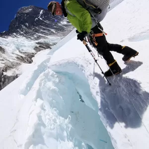 Negotiating a crevasse between Camps 1 and 2