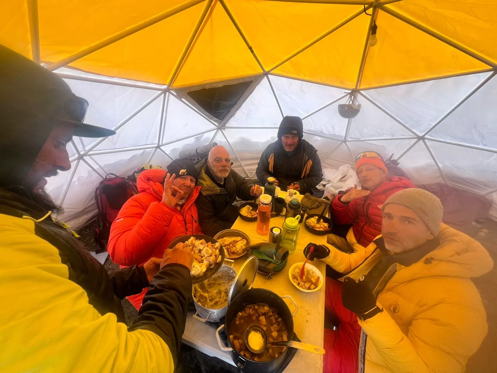The team enjoys dinner in the dining tent at High Camp.